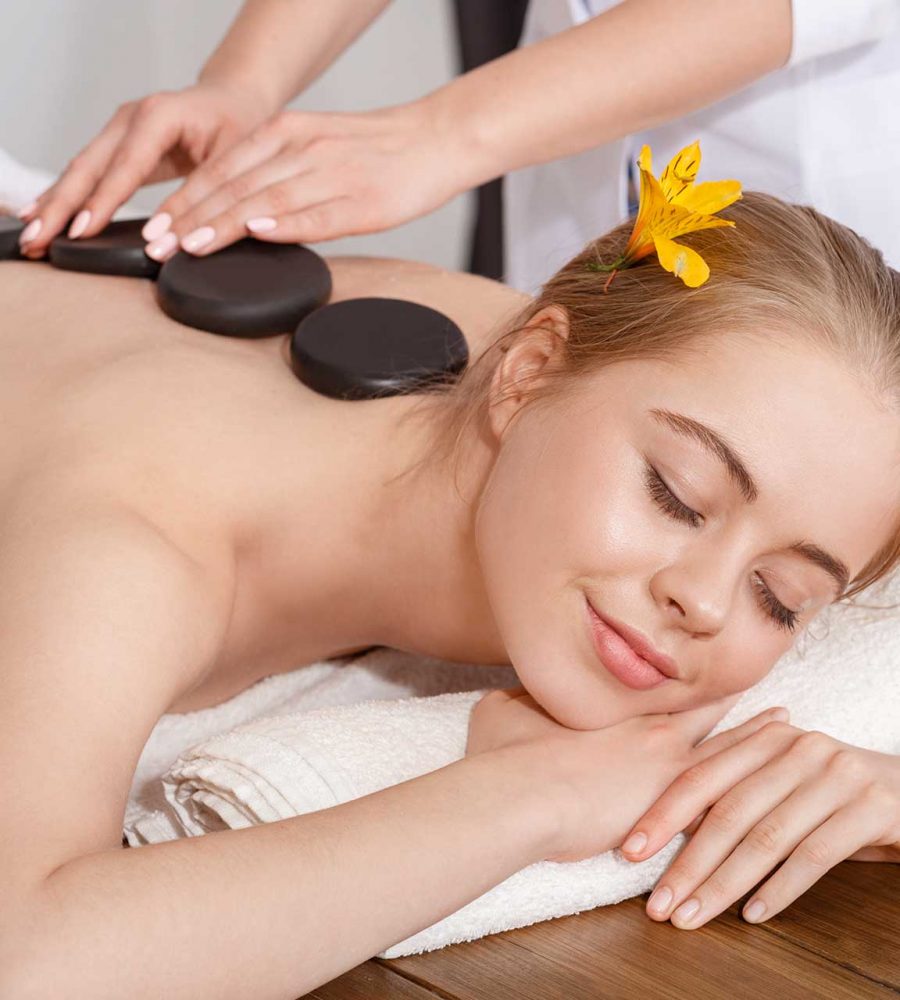 girl-with-closed-eyes-receives-hot-stone-massage-2022-10-07-01-12-43-utc
